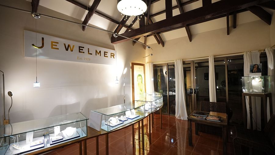 High-end jewelry store interior with elegant lighting and display counters.