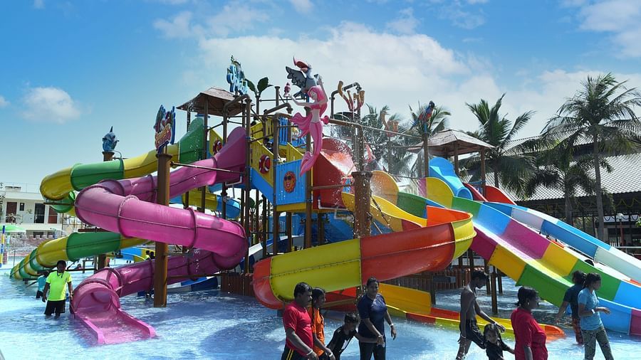 Side view of swimming pool with slides