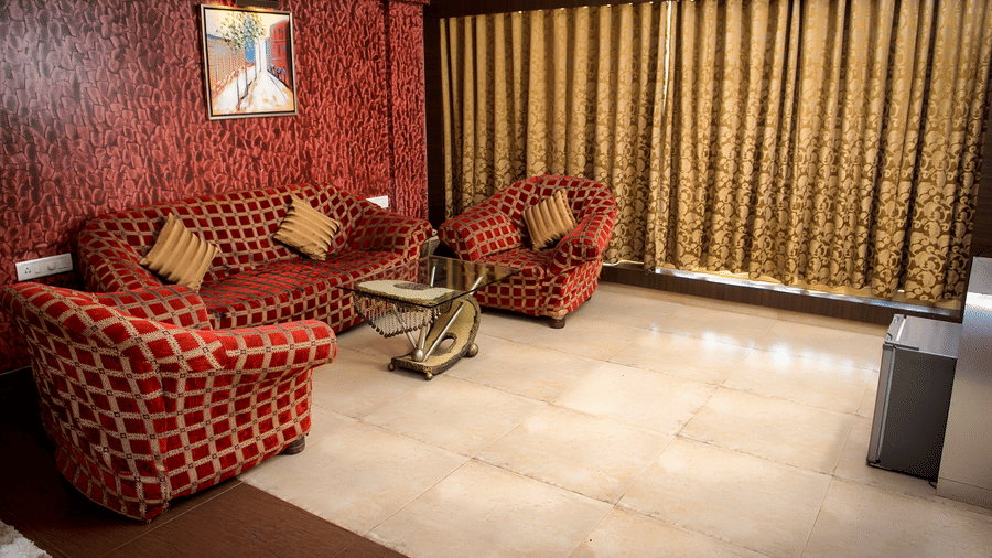 Royal Suite living area featuring sofas and a big widow.