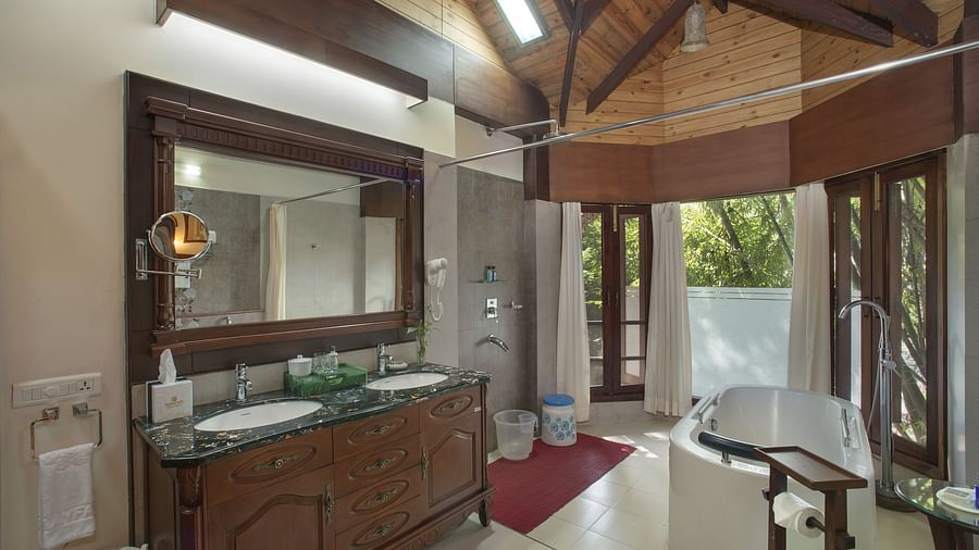 the bathroom showing a bathtub and a wash basin - Mayfair Spa Resort & Casino Gangtok 