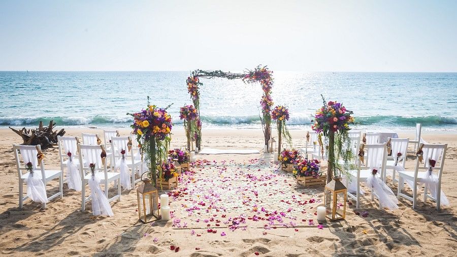 image of the beach side wedding setup at maikhao dream villa resort & spa, phuket