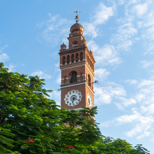Scenic view of the iconic Hussainabad Clock Tower against a clear blue sky in Lucknow.