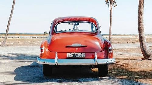 a vintage car at a beach