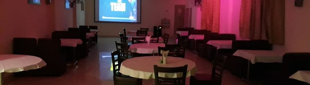 An image of a bar near IIT Roorkee decorated with cosy lights and tables - Motel Divine International, Roorkee