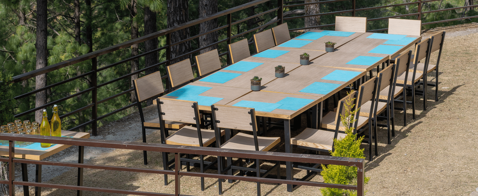 Lawn with neatly arranged chairs and a long table set up for an event at BluSalzz Escapade Resort, Lansdowne