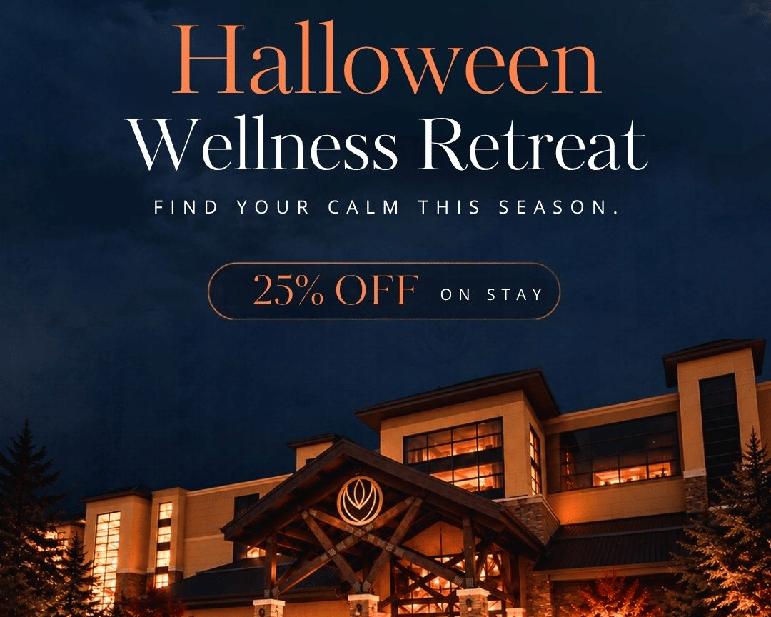 Halloween Wellness Retreat at YO1 Longevity & Health Resorts - the resort entrance lit up at night with carved pumpkins and autumn trees, with a 25% off on stay offer