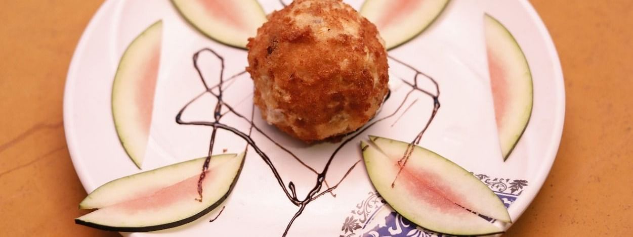 A dessert on a plate at Hotel Pai Viceroy Jayanagar