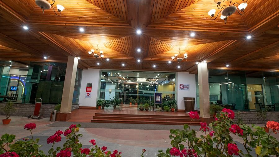 Mastiff Grand, Manali Manali		 front entrance of a building featuring flowers - Mastiff Grand,
