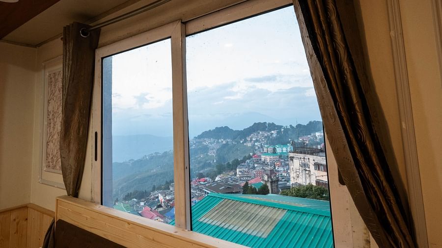 an image of a valley view from the premium room with balcony room category at Avianna New Mandala Hotel & Spa, Darjeeling