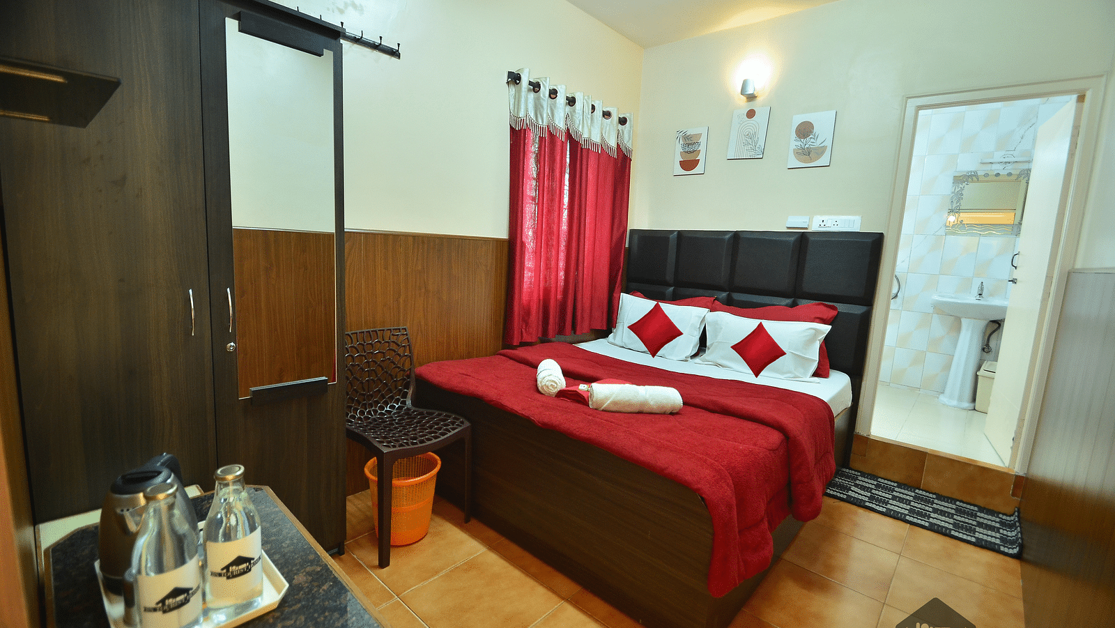 Image of a room with a wardrobe and a bed at BN Tourist Home, Ooty.