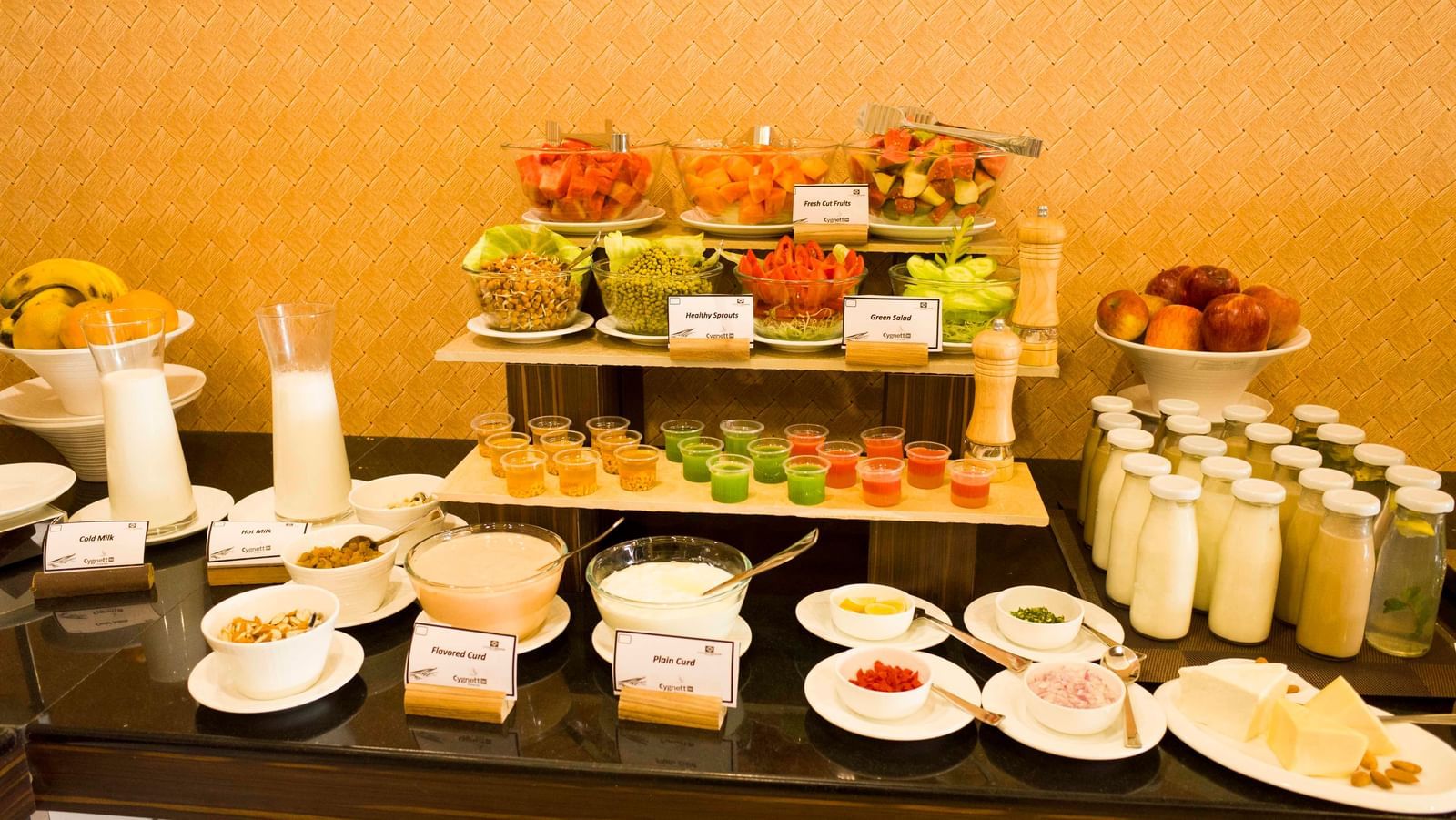 A lavish buffet spread with a variety of appetizers, salads, and condiments | Daksh The Madhuvan Suites