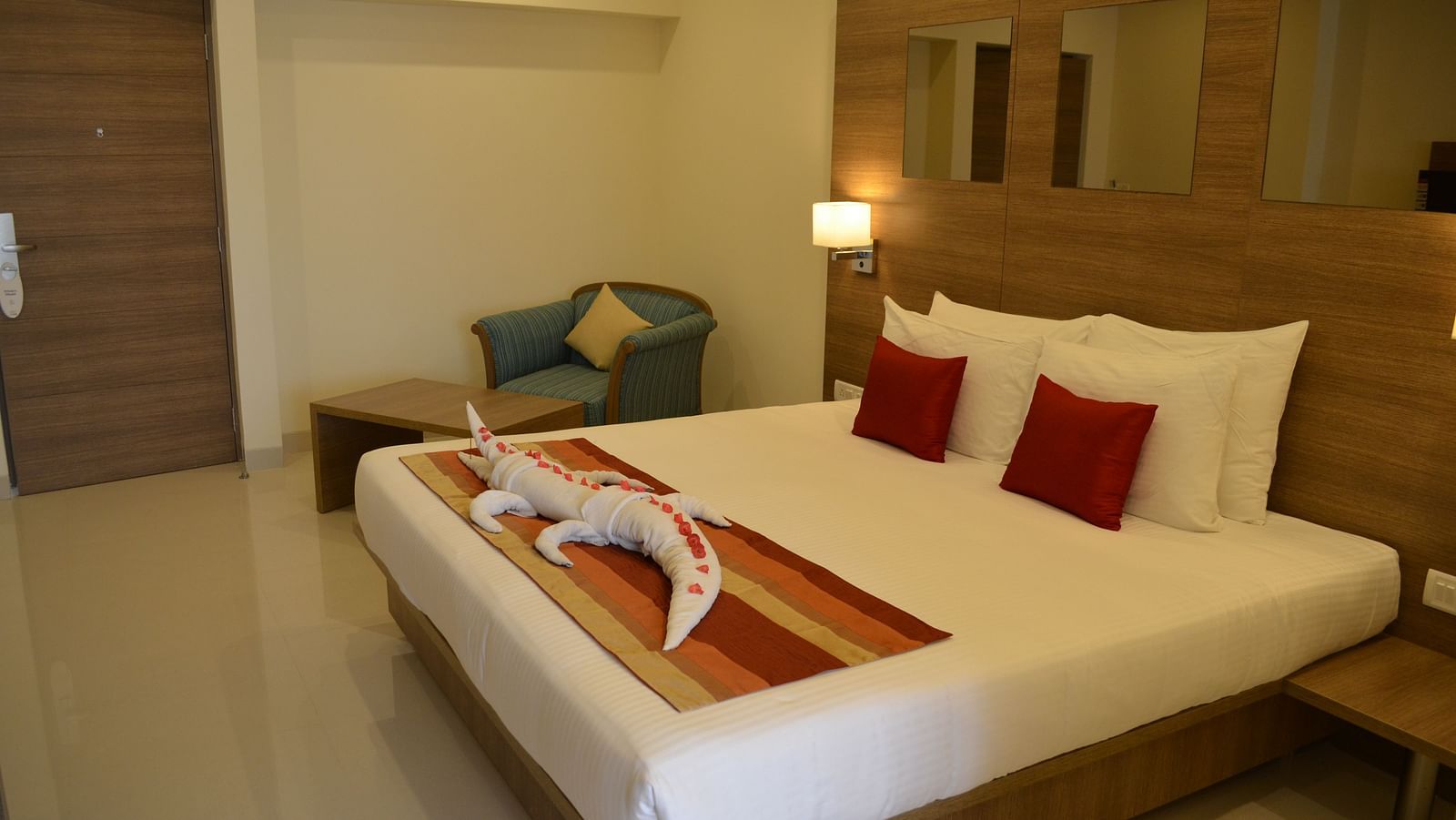An image of a king size bed of a room at Regency Tiruttani by GRT Hotels.
