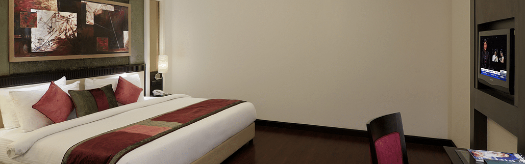 view of large size bed in Suite room of Inde Hotel Vista Woods, Gurgaon 