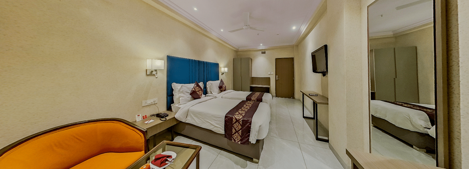 Premium twin bed accommodation at Lords Eco Inn Dahej featuring matching beds, stylish furnishing, and comprehensive guest amenities