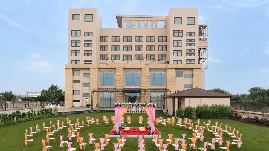 A facade with event space with several chairs and tables | Essentia Luxury Hotel and Convention, Nagpur