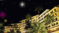 The exterior of The Retreat Hotel and Convention Centre Madh Island Mumbai lit up at night