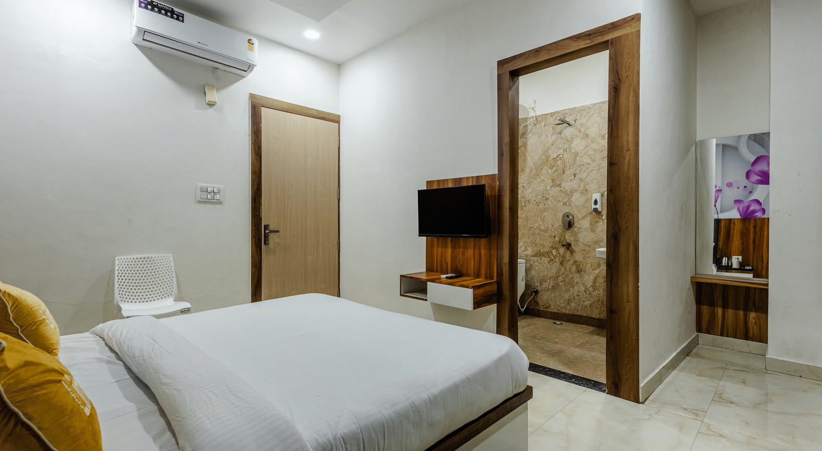 A side view of a room, showing the wooden wardrobe and attached bathroom - Lime Tree Hotels & Banquet, Vrindavan