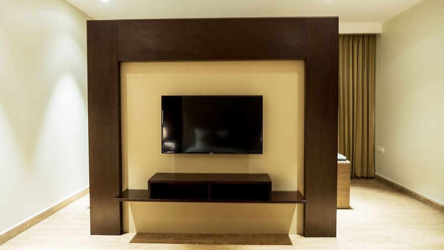 A view of the TV from the bed of Suite at Grand Ashok, Thanjavur.