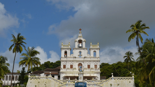 A Church with its white facade and iconic zigzag staircase.