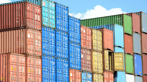 An overview of many containers in different colours stacked on top of each other.