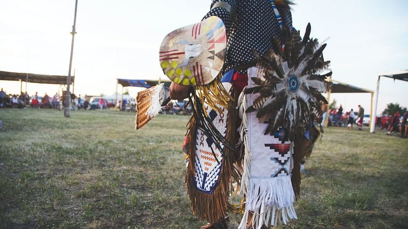 a person wearing a native attire and celebrating a festival