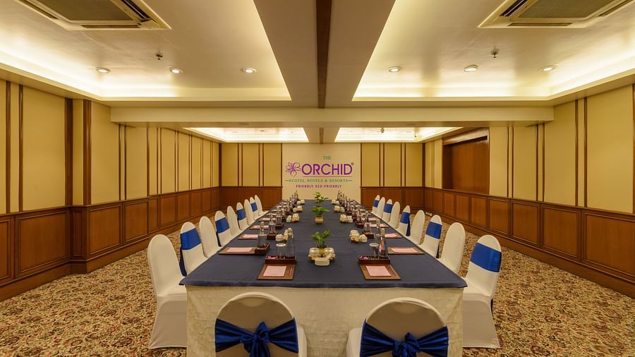 Corporate boardroom setup with projector and tables at The Orchid Hotel Mumbai Vile Parle
