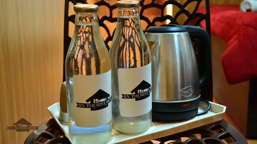 Image of two water bottles and an electric kettle at BN Tourist Home, Ooty.