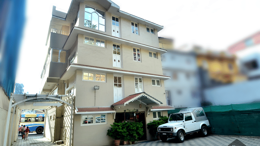 Facade of BN Tourist Home with a car parked in front of it.