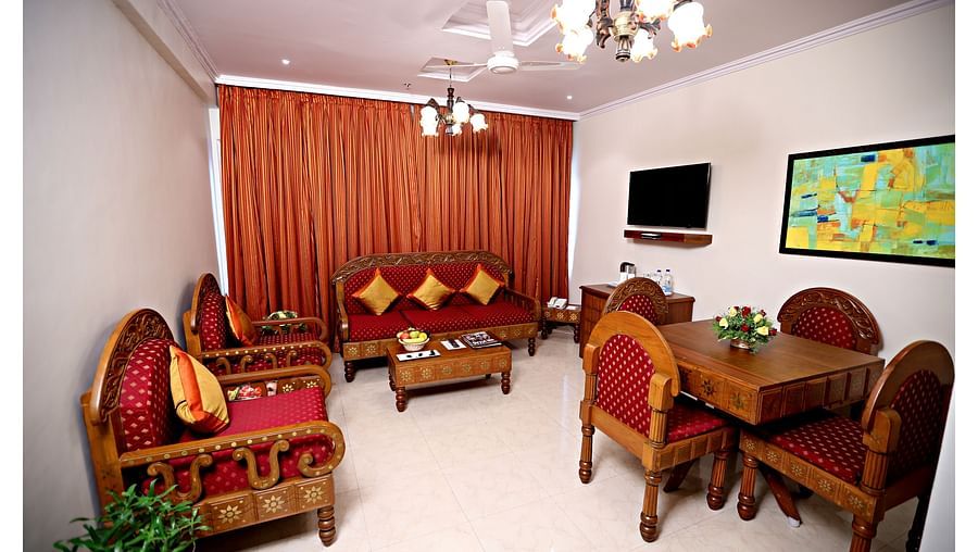 the living space with a sofa set and centre table at Deluxe suites in Vizag 2