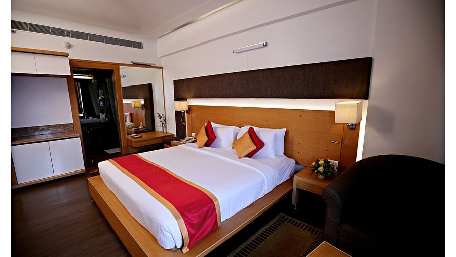 a plush king size bed offered by Executive Suites in Vizag