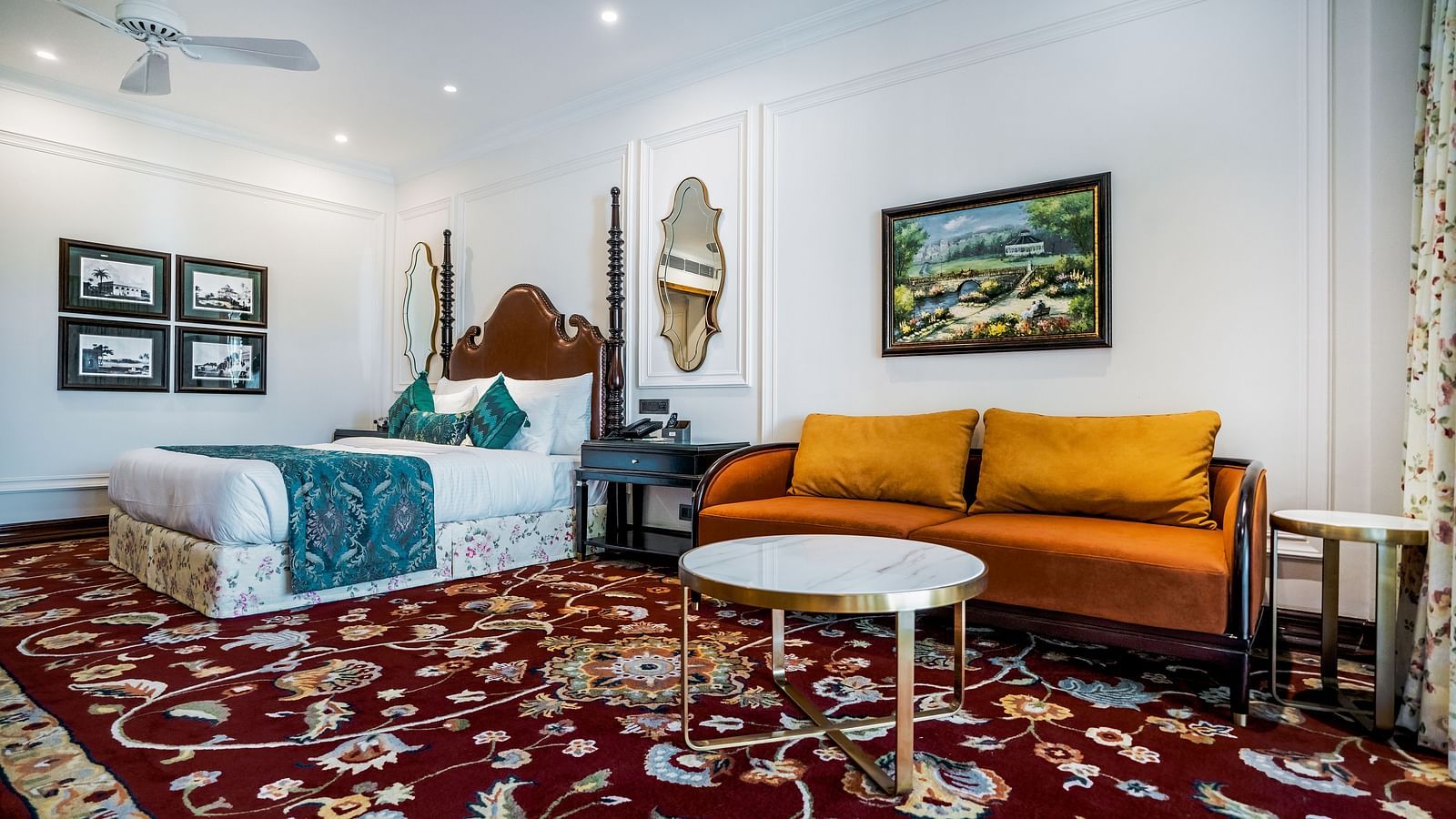 Suite with twin beds, golden sofa, and classic decor at MAYFAIR Tea Resort, Siliguri