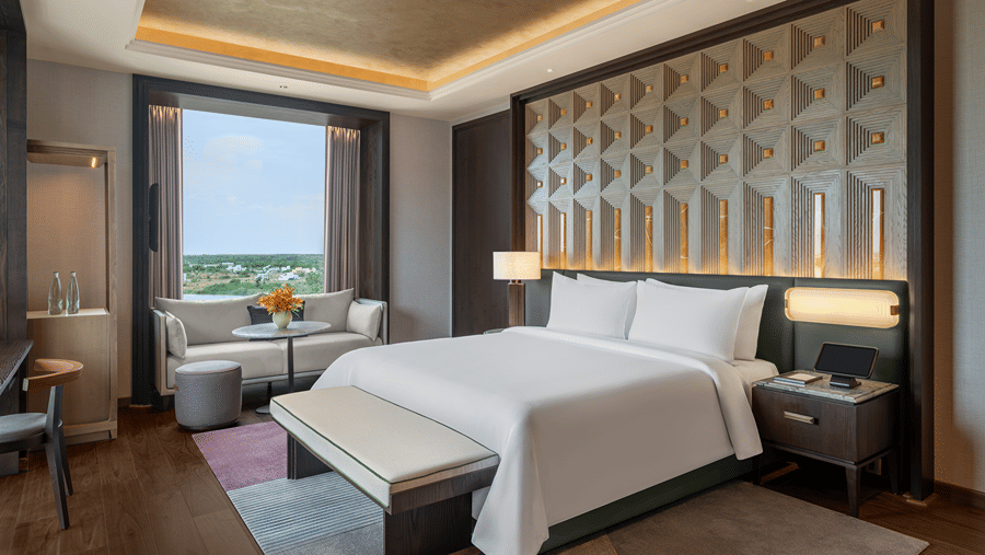 Presidential Suite Room 8001 Bedroom 2 with a bed and window garden view at The Residency Signature Madurai.