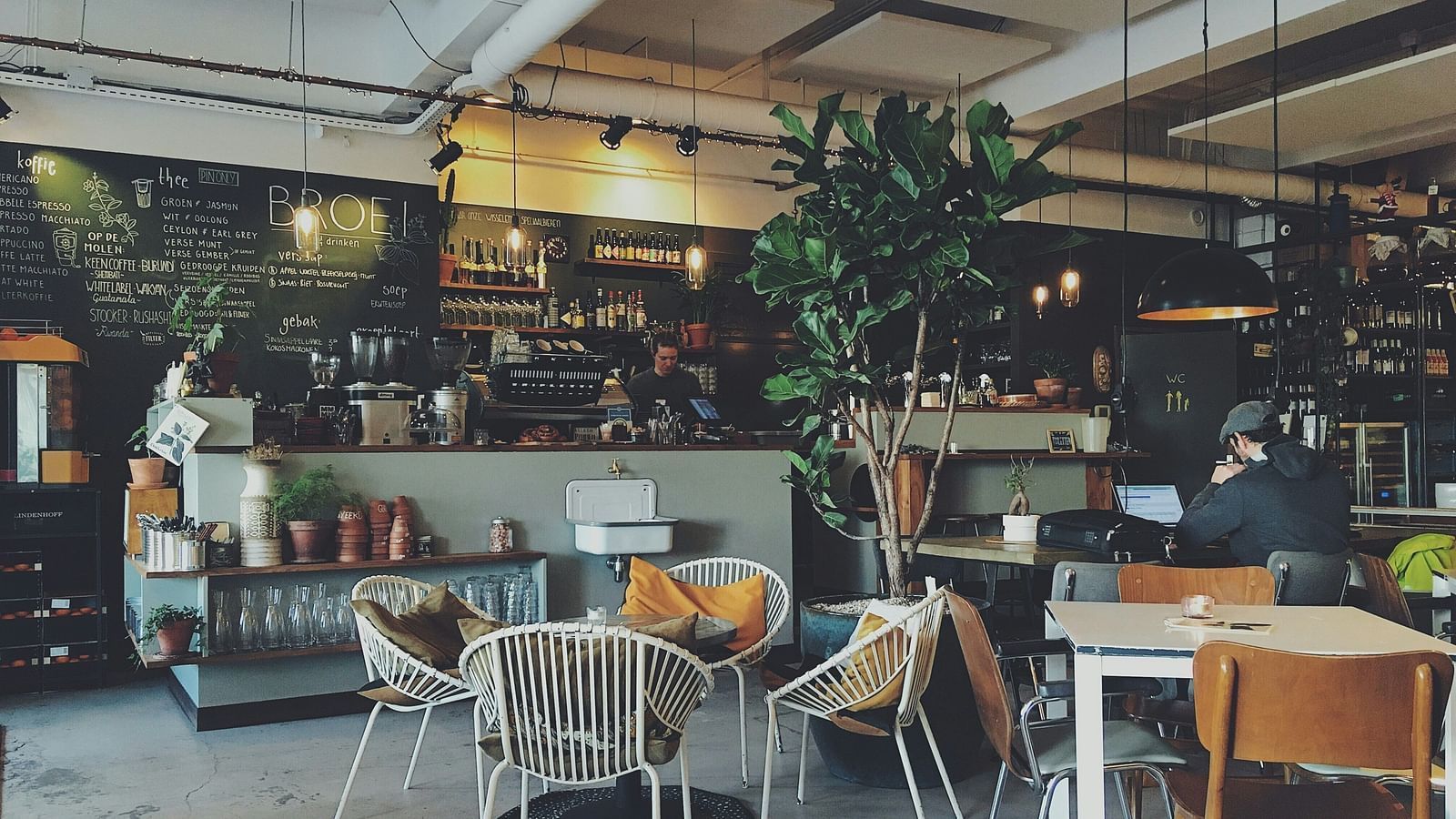 Image of a cafe with seating area and a counter table.