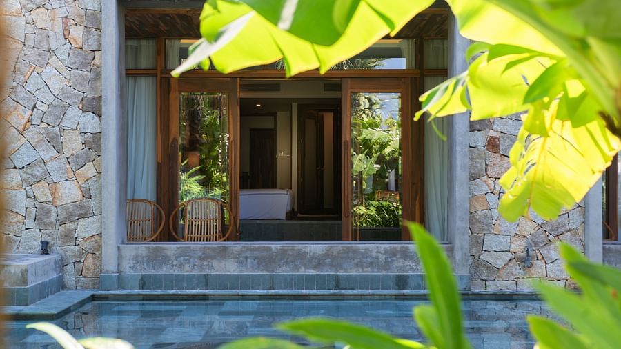 A view of the hotel room with a sliding door - Alibu Resort Nha Trang