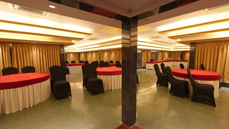 Wide view of the round tables and chairs at Moti Mahal, our in-house banquet hall at The Garden Ananta Elite, Rajkot 2