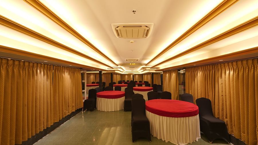 Chairs and round tables at Moti Mahal, our in-house banquet hall at The Garden Ananta Elite, Rajkot 3