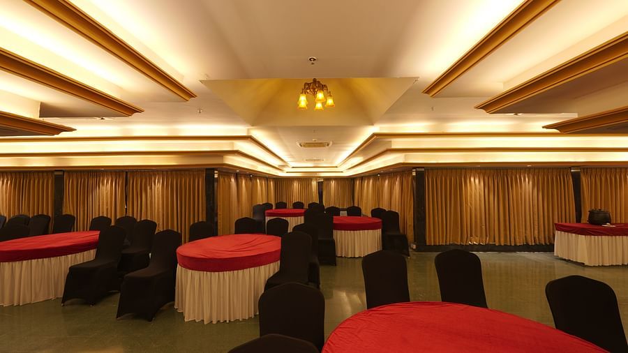 Chairs and round tables at Moti Mahal, our in-house banquet hall at The Garden Ananta Elite, Rajkot 4
