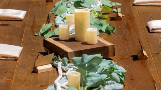 Elegant wedding reception table decorated with floral arrangements and candles for an intimate celebration at Kit Carson Lodge.