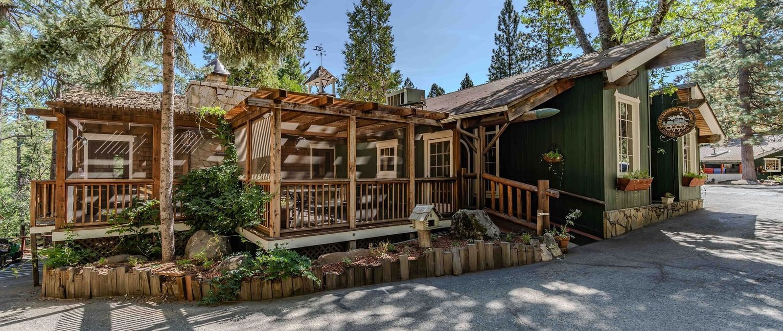 Exterior of the cabins at Narrow Gauge Inn during the day.