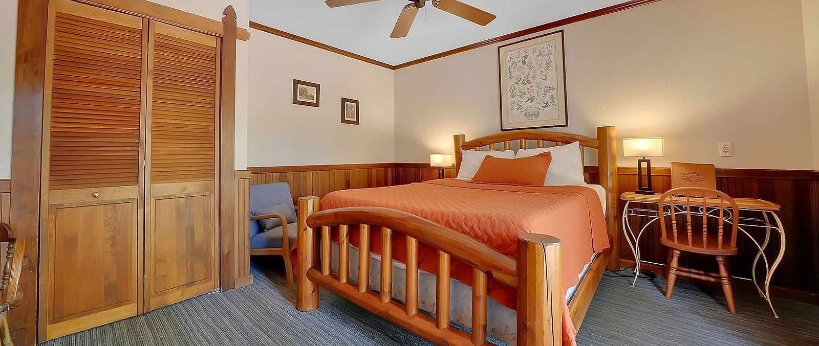 A view of a room at Narrow Gauge Inn with a double bed.
