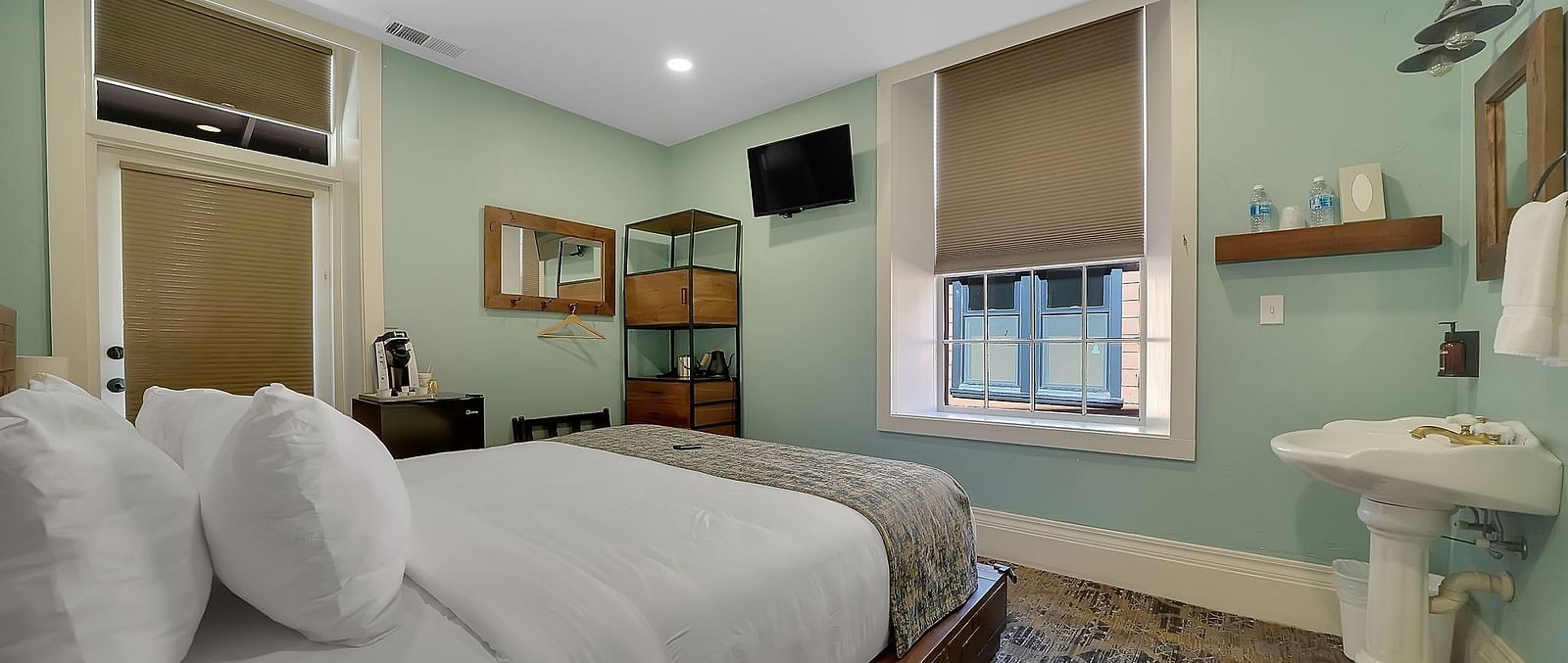 A view of a room at The Groveland Hotel with a double bed.