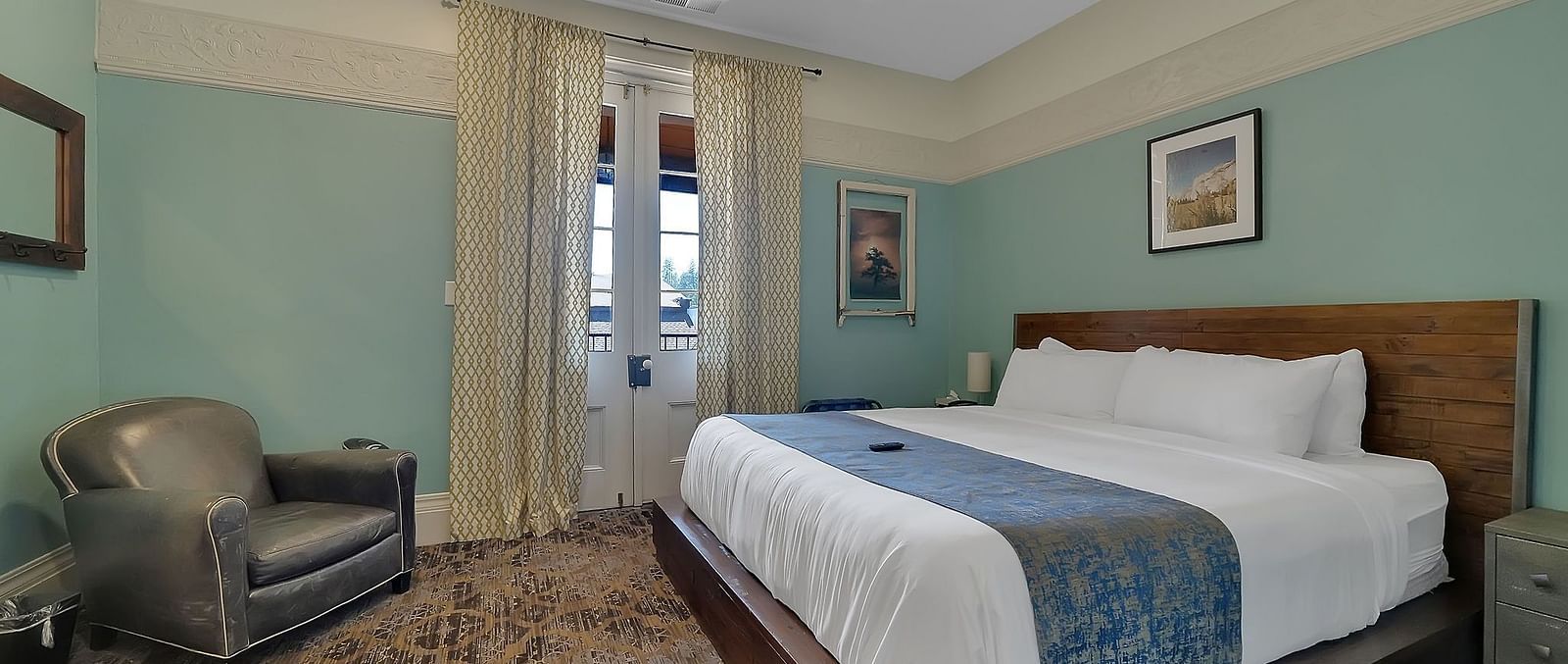 A view of a room at The Groveland Hotel with a double bed.