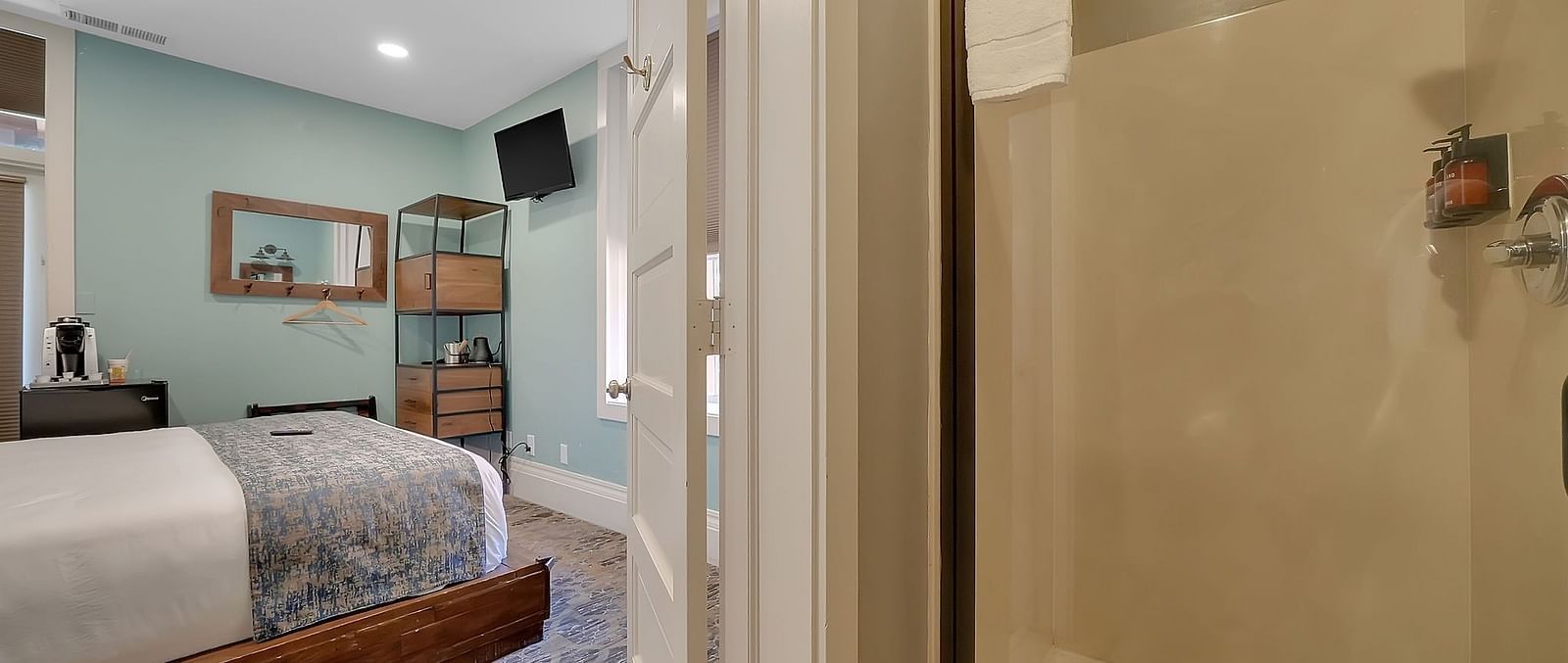 A view of a room at The Groveland Hotel with a double bed.