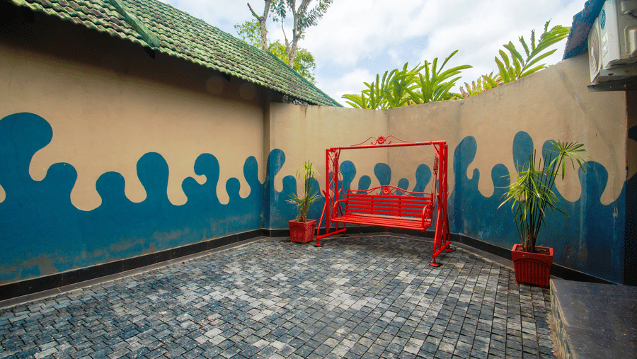 Image of a kids play area with a swing at Coorg Jungle Camp Backwater Resort, Kushalnagar.