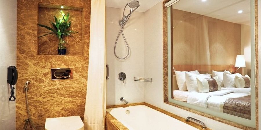 bathroom overlooking the room - Bawa Group of Hotels