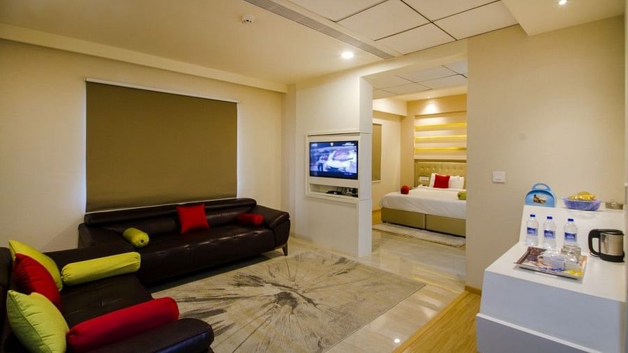 Sitting room of the Suite with sofa and television at Art Boutique Hotel, Hyderabad