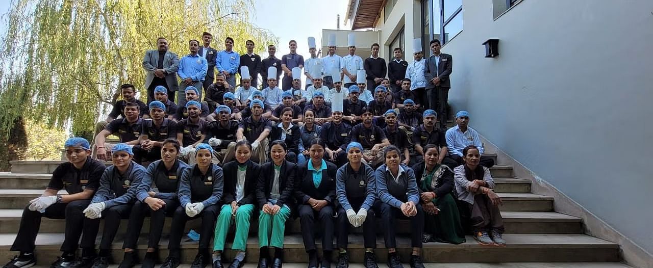 A group photograph of the entire hospitality staff working at The Golden Tusk Resort - Ivory Destinantions
