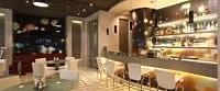 Shot of the lounge at our hotel featuring dim lighting with a bar counter. | Mirage Hotel