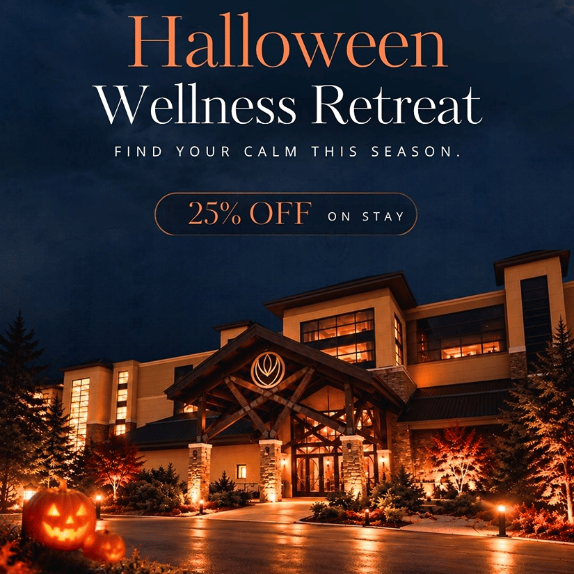 Halloween Wellness Retreat at YO1 Longevity & Health Resorts - the resort entrance lit up at night with carved pumpkins and autumn trees, with a 25% off on stay offer