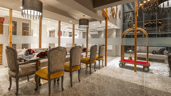 an image of outer view of dining space covered by glass at Mastiff Select Mandavya Dharamkot, McLeodganj